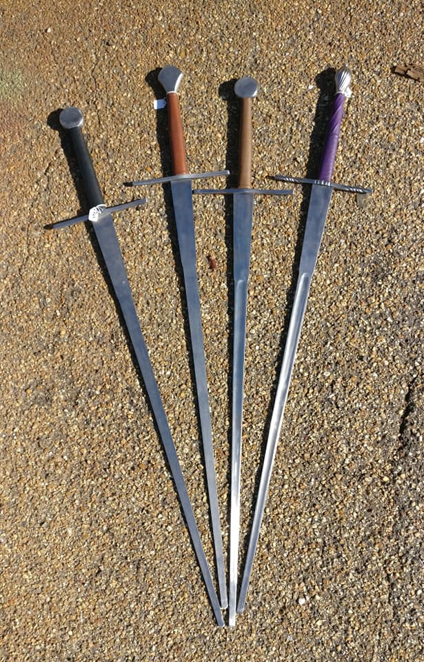 Several Italian Scrimiator schilt-less feders produced by Darkwood Armory