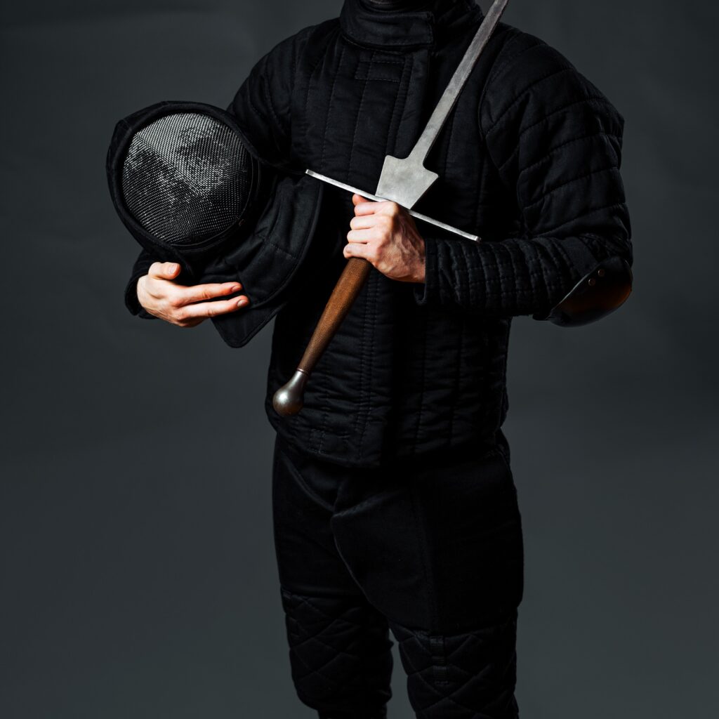 Wearing proper fencing gear for HEMA tournaments is critical for the safety of all fighters.
